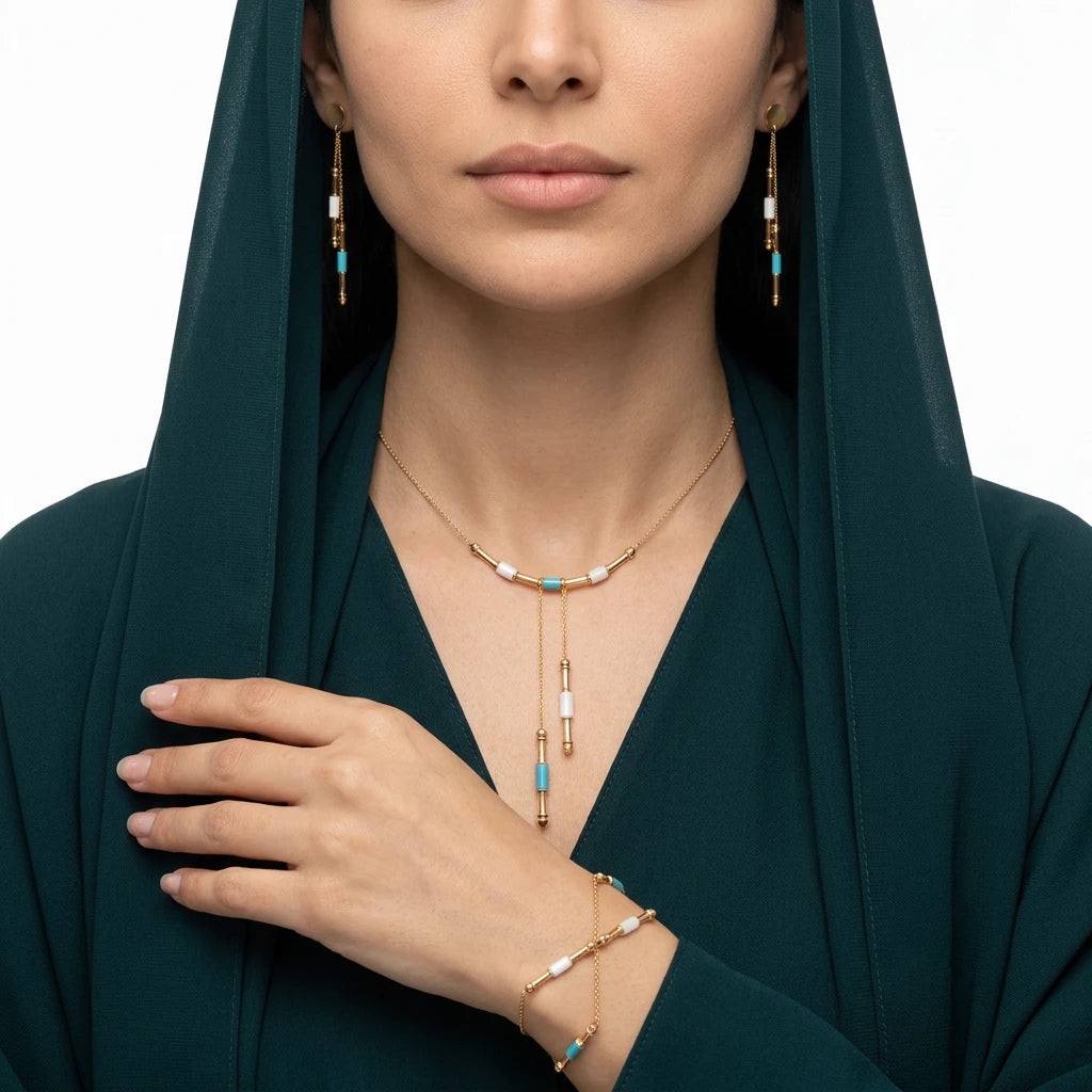 Half-set of 18k gold, Lariat design