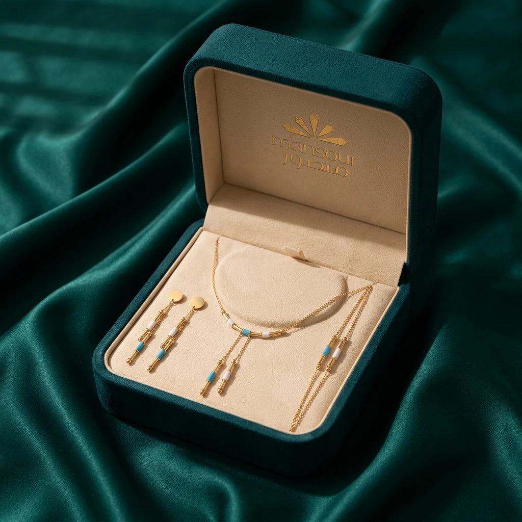 Half-set of 18k gold, Lariat design