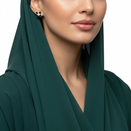 أقراط ذهب عيار 18 بفص مركزي مثبت