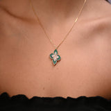 18 karat gold set with green leaf design