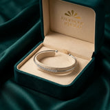 18K Gold Bracelet with Embellished Twisted Frame