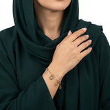 اسوارة ذهب عيار 18 بتصميم زهور متدلية