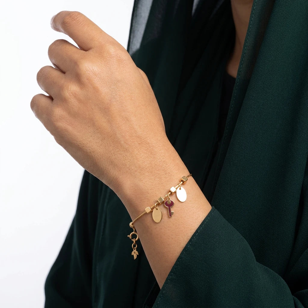 18K Gold Bracelet with Key and Dangling Charms