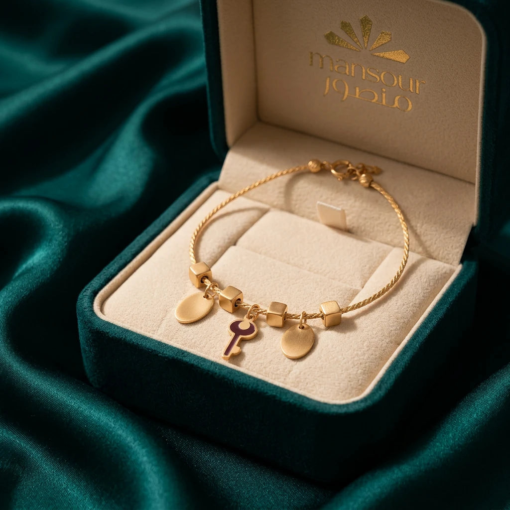 18K Gold Bracelet with Key and Dangling Charms