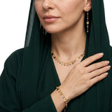 نصف طقم ذهب عيار 18 بلمسة زهرية متناغمة