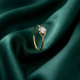 18K Gold Ring with Small Sparkling Stone Design