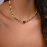 18K gold set with red stones