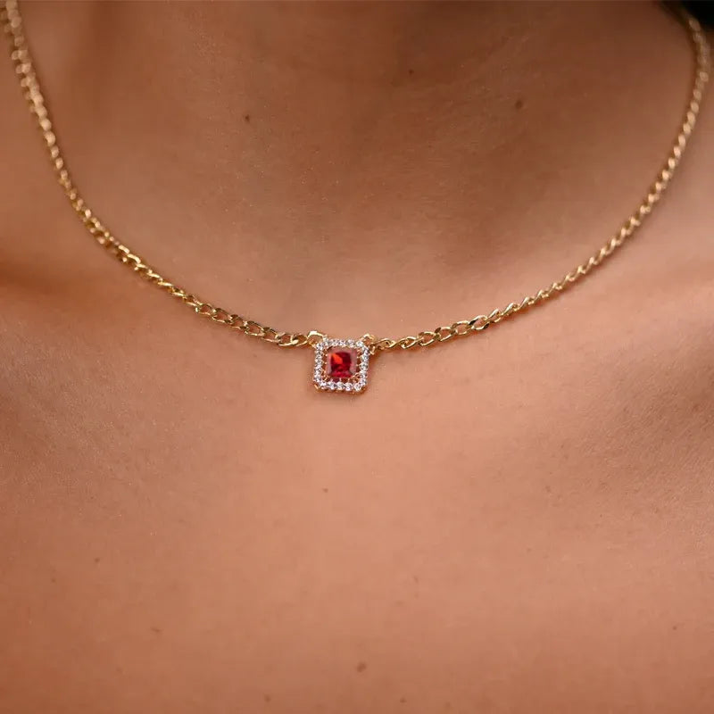 18 karat gold set with red stone, including chain and earrings