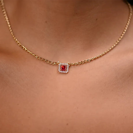 18 karat gold set with red stone, including chain and earrings